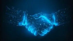 Un apretón de manos digital con estética futurista simboliza la cooperación cripto entre Reino Unido y Estados Unidos.